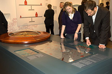People playing roulette in the exhibition